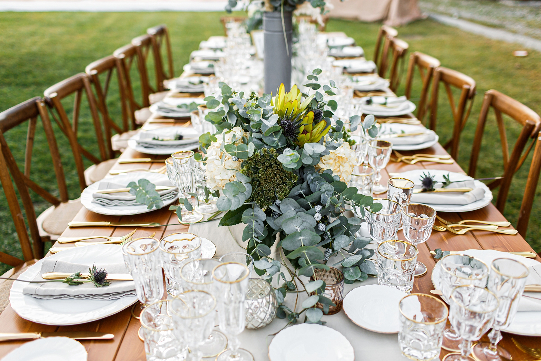 Event table set up in boho style with pampas grass and greenery